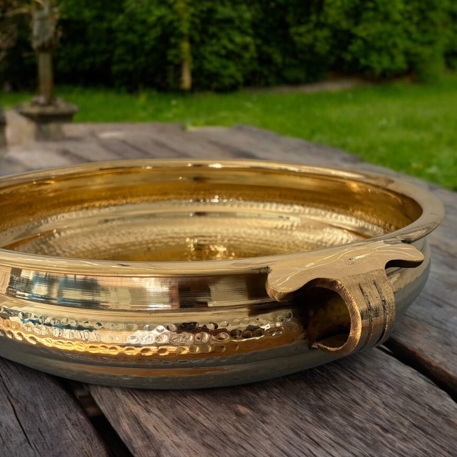 Handcrafted brass urli bowl filled with floating flowers – perfect for Indian home decor and festive celebrations