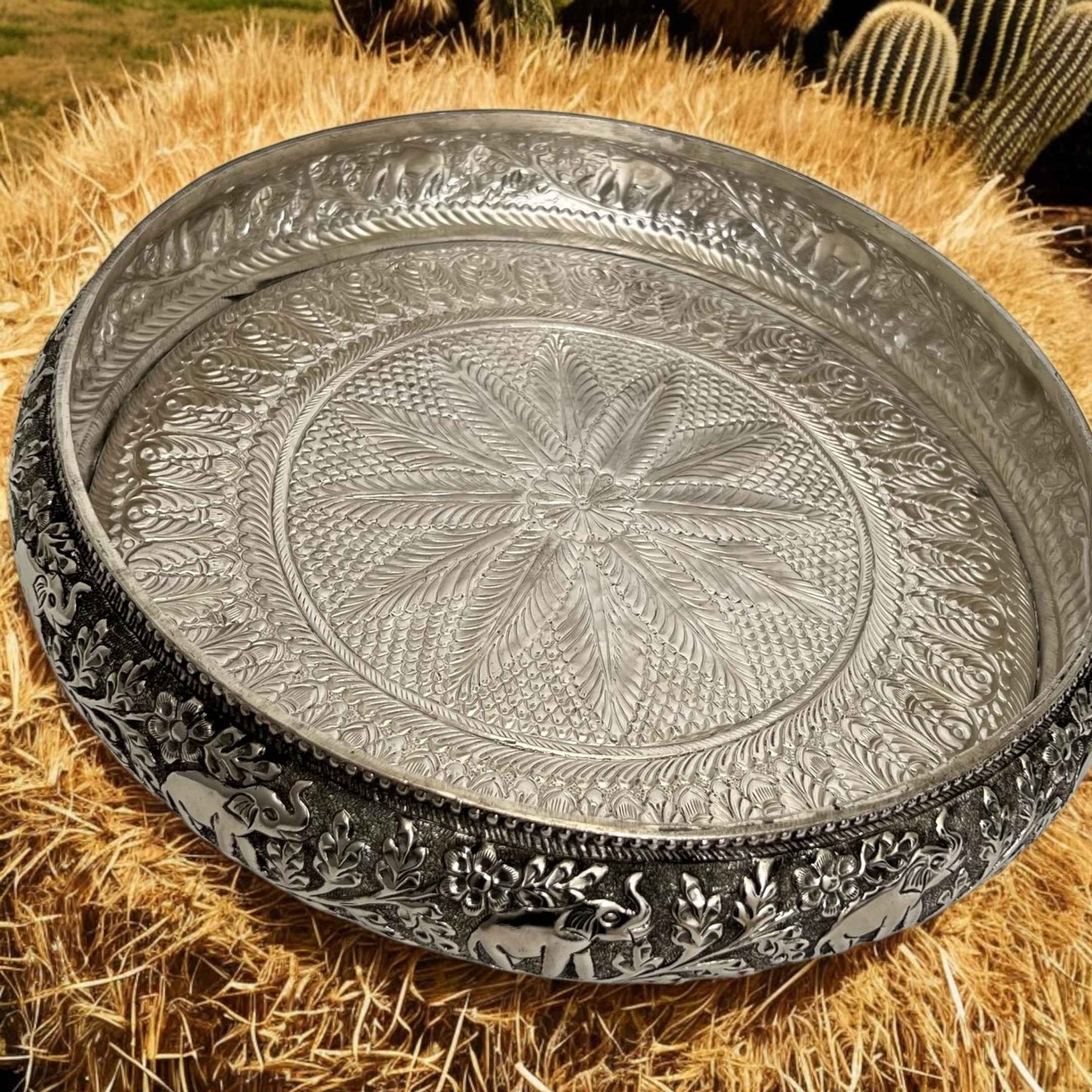 Decorative antique silver urli bowl with handcrafted elephant engravings, perfect for pooja and gifting