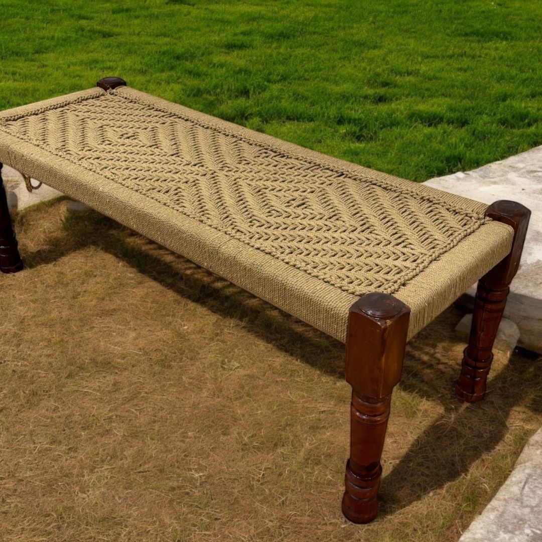 Handcrafted Charpai bench with intricately woven jute cord top, showcasing a clean and organic aesthetic.