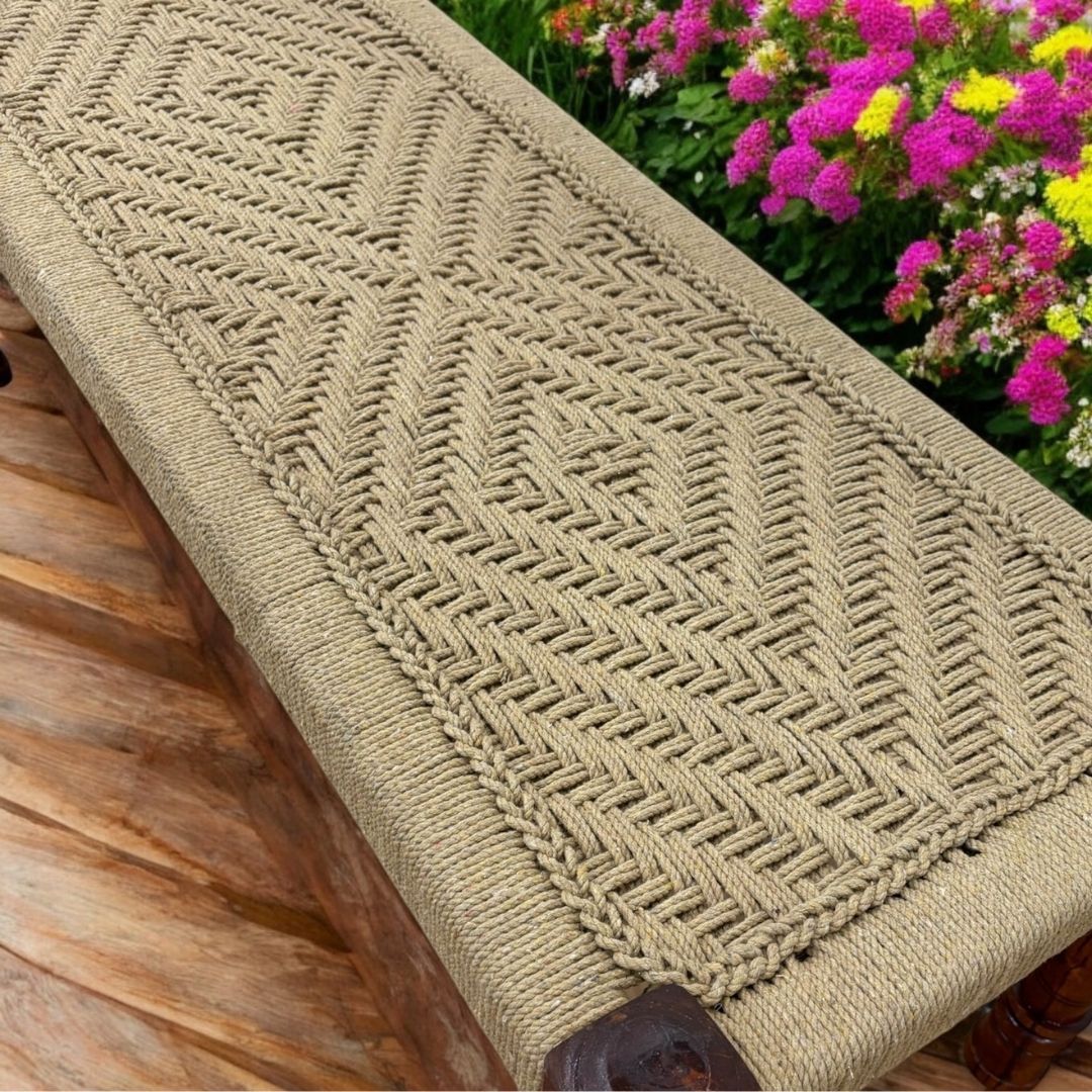 Handcrafted Charpai bench with intricately woven jute cord top, showcasing a clean and organic aesthetic.