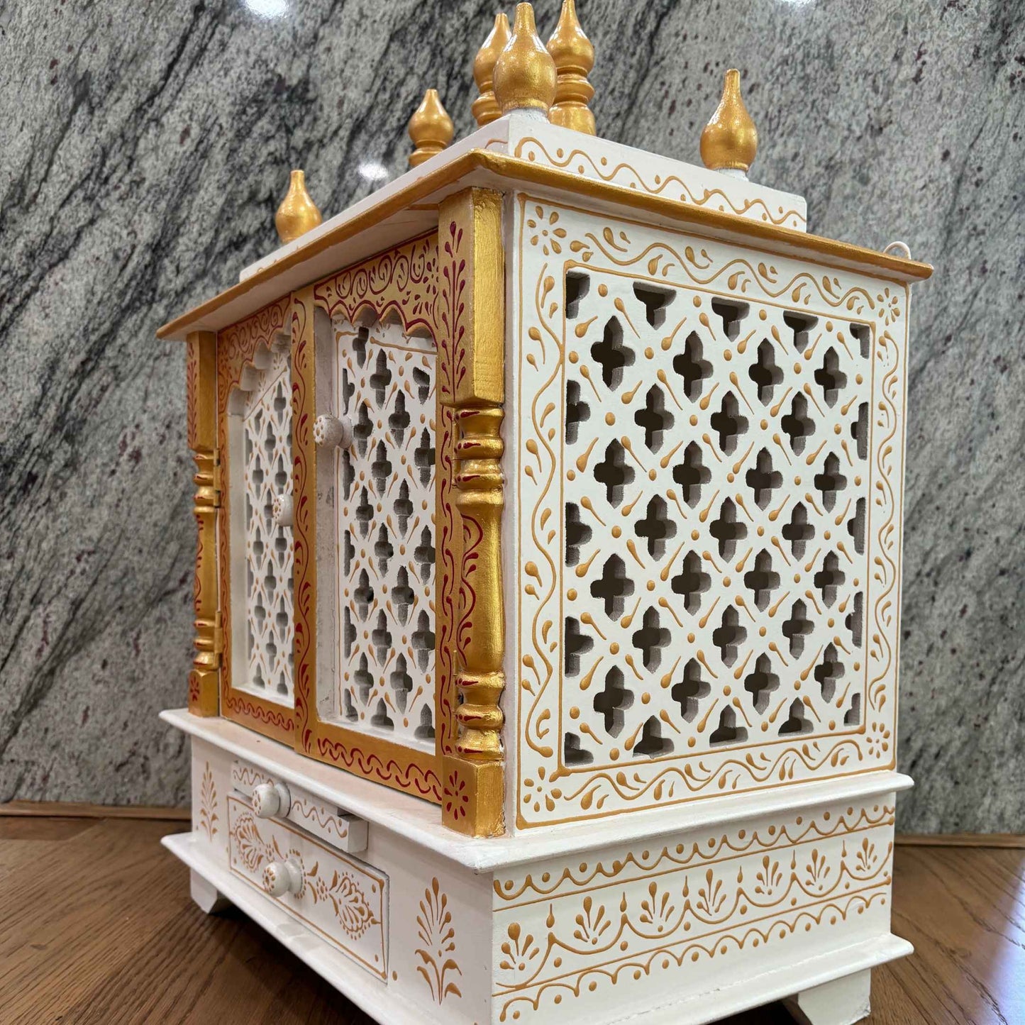 Made from solid mango wood with intricate embossed painting