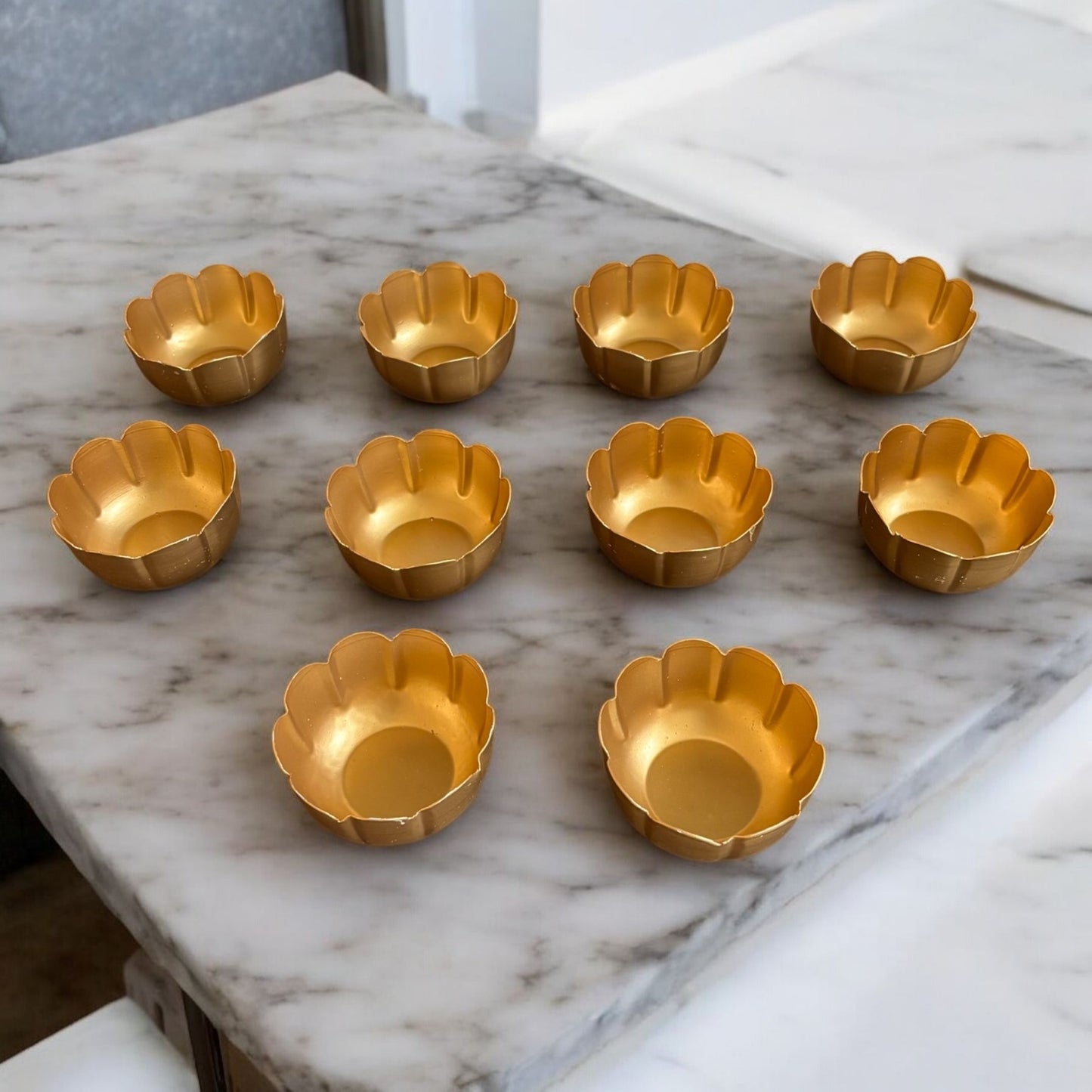 Front view of the Vibrant Metal Utsav Diya Set, showcasing 10 gold color Diwali tealights