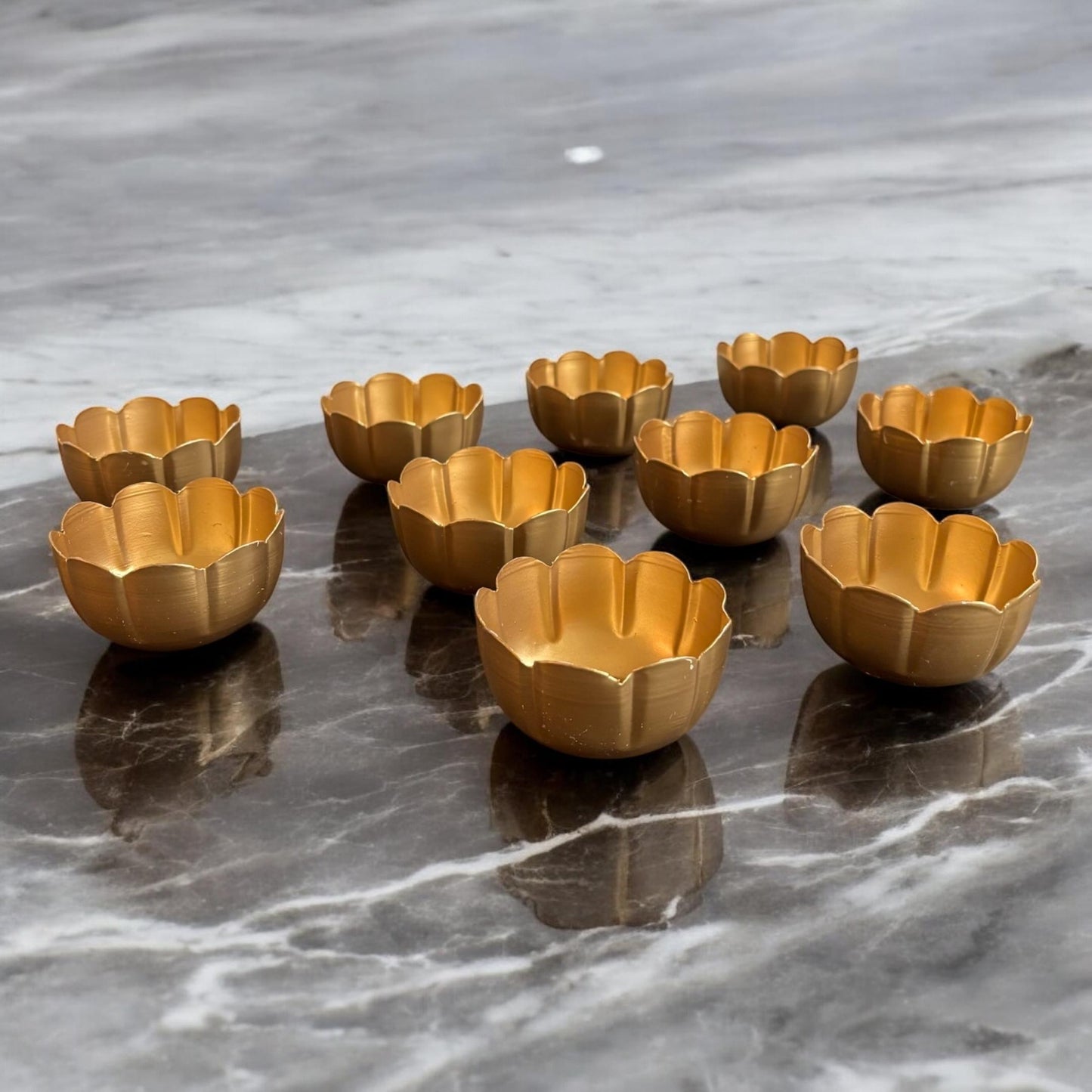 Side angle of t-light holder set of 10 metal diyas by Urli Utsav Decor