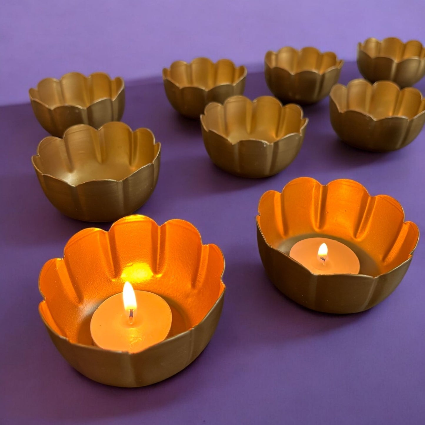 Front view of the Vibrant Metal Utsav Diya Set, showcasing 10 gold color Diwali tealights