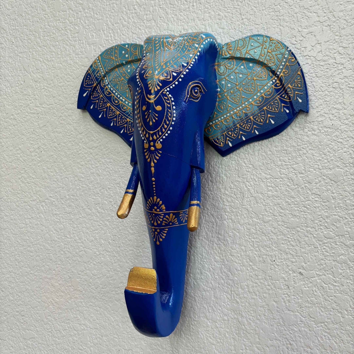 Hand-painted 17-inch wooden blue elephant head wall art with vibrant Indian-inspired designs