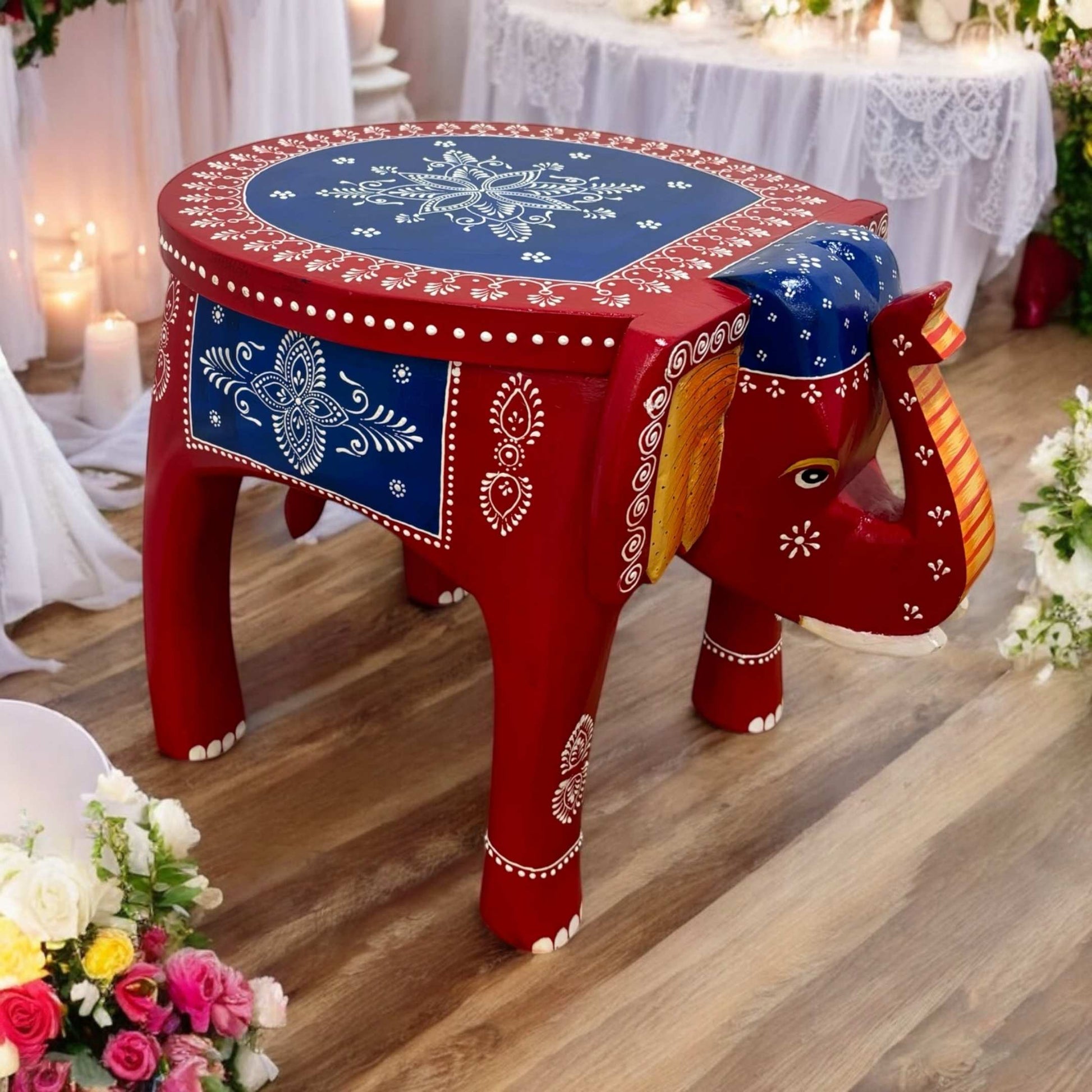 red blue elephant stool displayed as a stylish accent table in a wedding setting