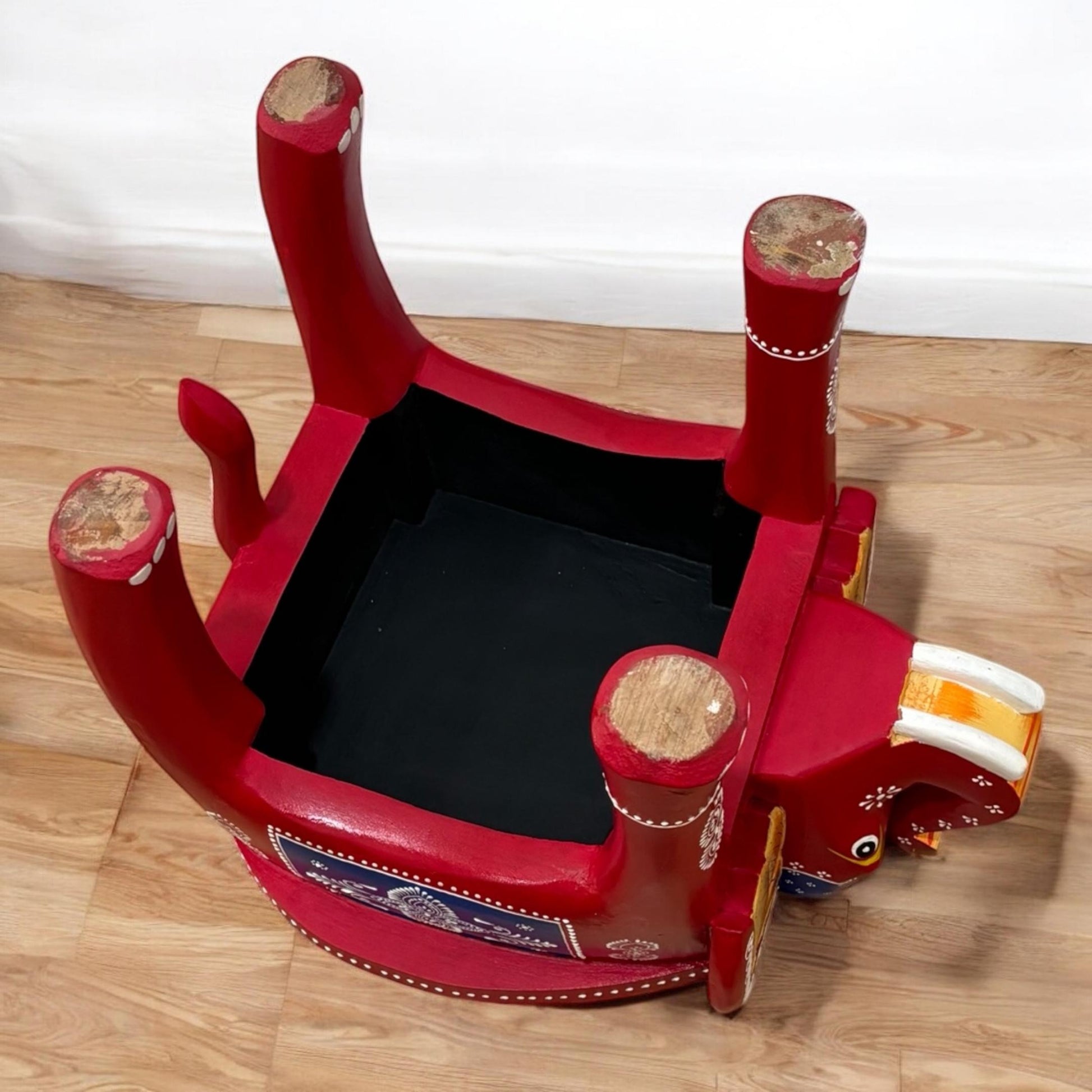 Bottom view of Wooden elephant stool with hand-carved details, perfect for a boho side table or coffee table