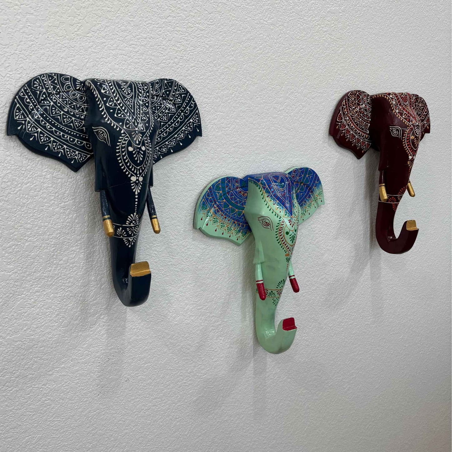 Close-up of the intricate hand-carved details on the wooden elephant head