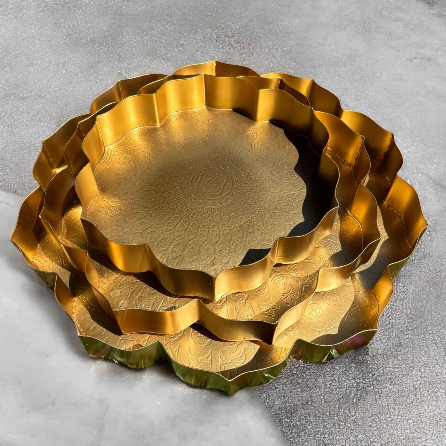 The three lotus urli bowls nested together to illustrate their size differences and stacking capability.