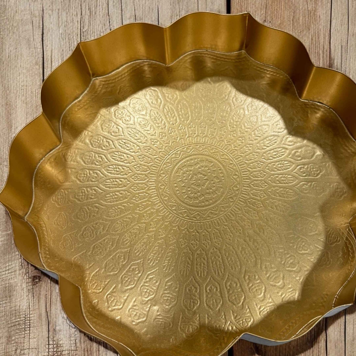 Close-up of the hammered texture on the surface of a lotus urli bowl, highlighting the handcrafted details.