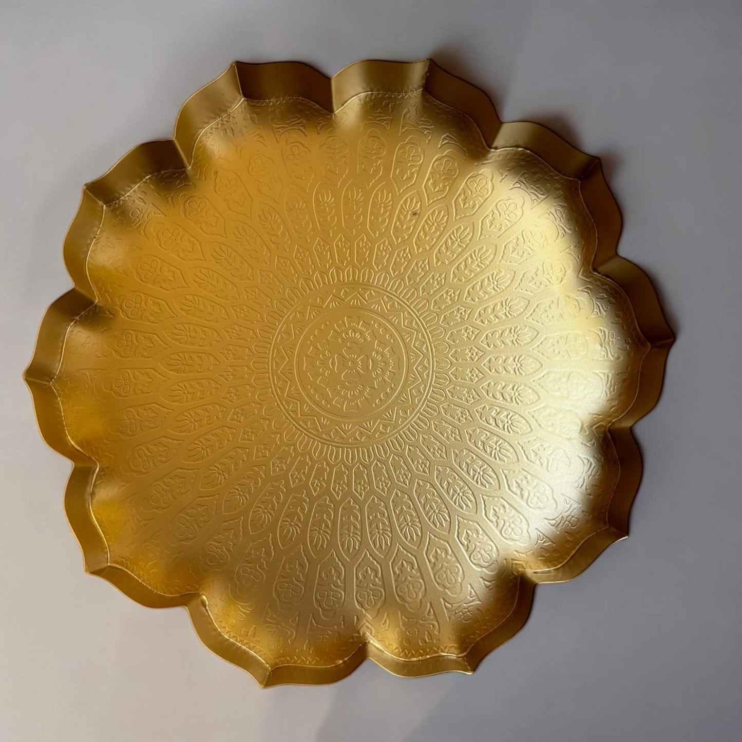 Close-up of the hammered texture on the surface of a lotus urli bowl, highlighting the handcrafted details