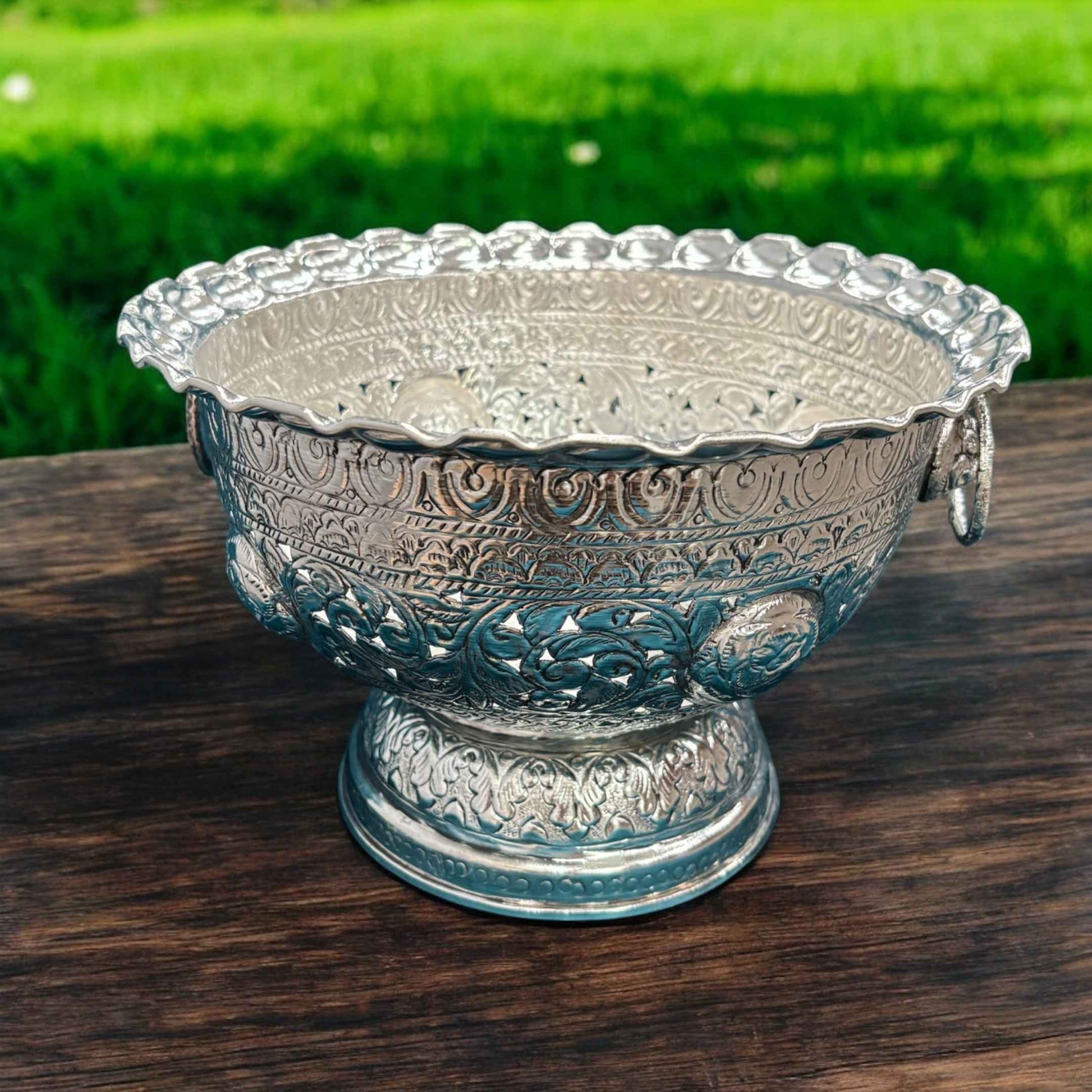 A 6.5-inch tall fruit bowl made of brass with antique silver plating, featuring a wide, shallow design with a 9.5-inch diameter, displayed empty to showcase its elegant craftsmanship