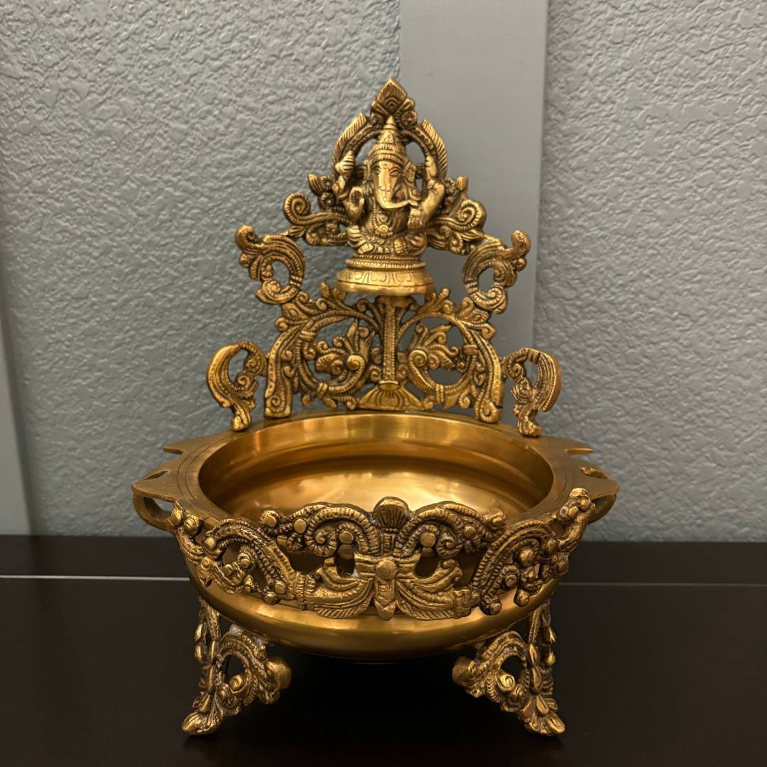 Detailed view highlighting the fine craftsmanship of the Ganesha figure, showcasing traditional Indian artistry in polished brass