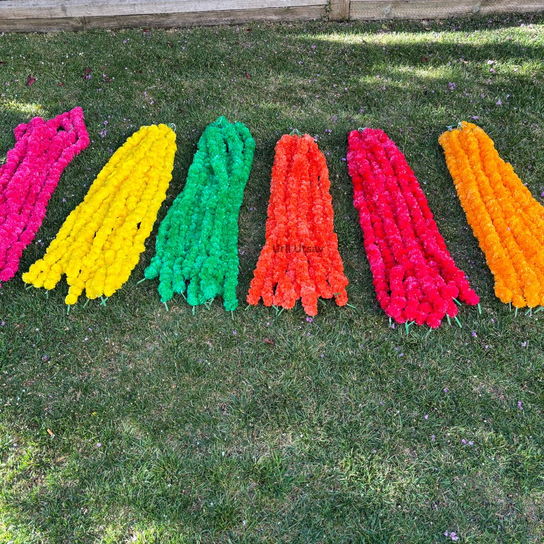 A set of ten vibrant artificial marigold garlands in shades of orange and yellow, each measuring 4 feet in length