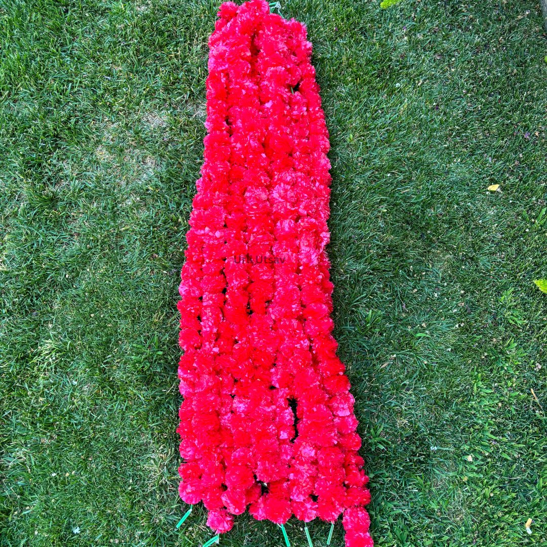 A set of ten red artificial marigold garlands from Urli Utsav Decor, priced approx $2 per string
