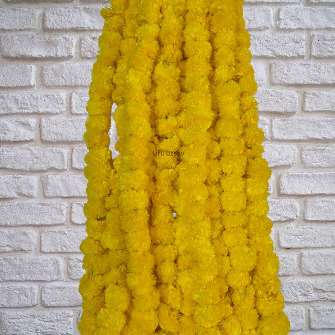 The set of ten yellow red marigold garlands displayed in a fan arrangement, emphasizing the volume and decorative potential of the set