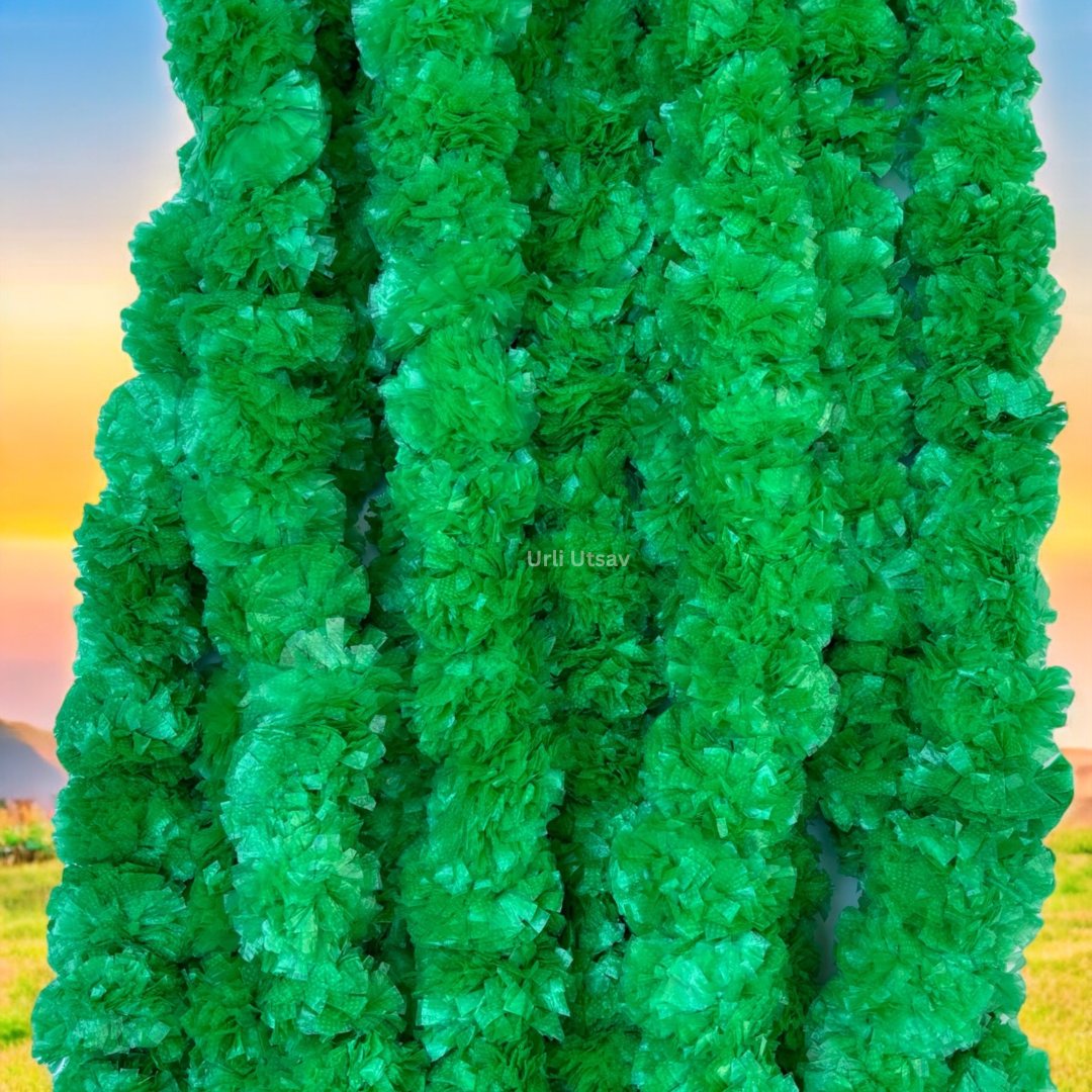 A set of ten green artificial marigold garlands from Urli Utsav Decor, priced approx $2 per string