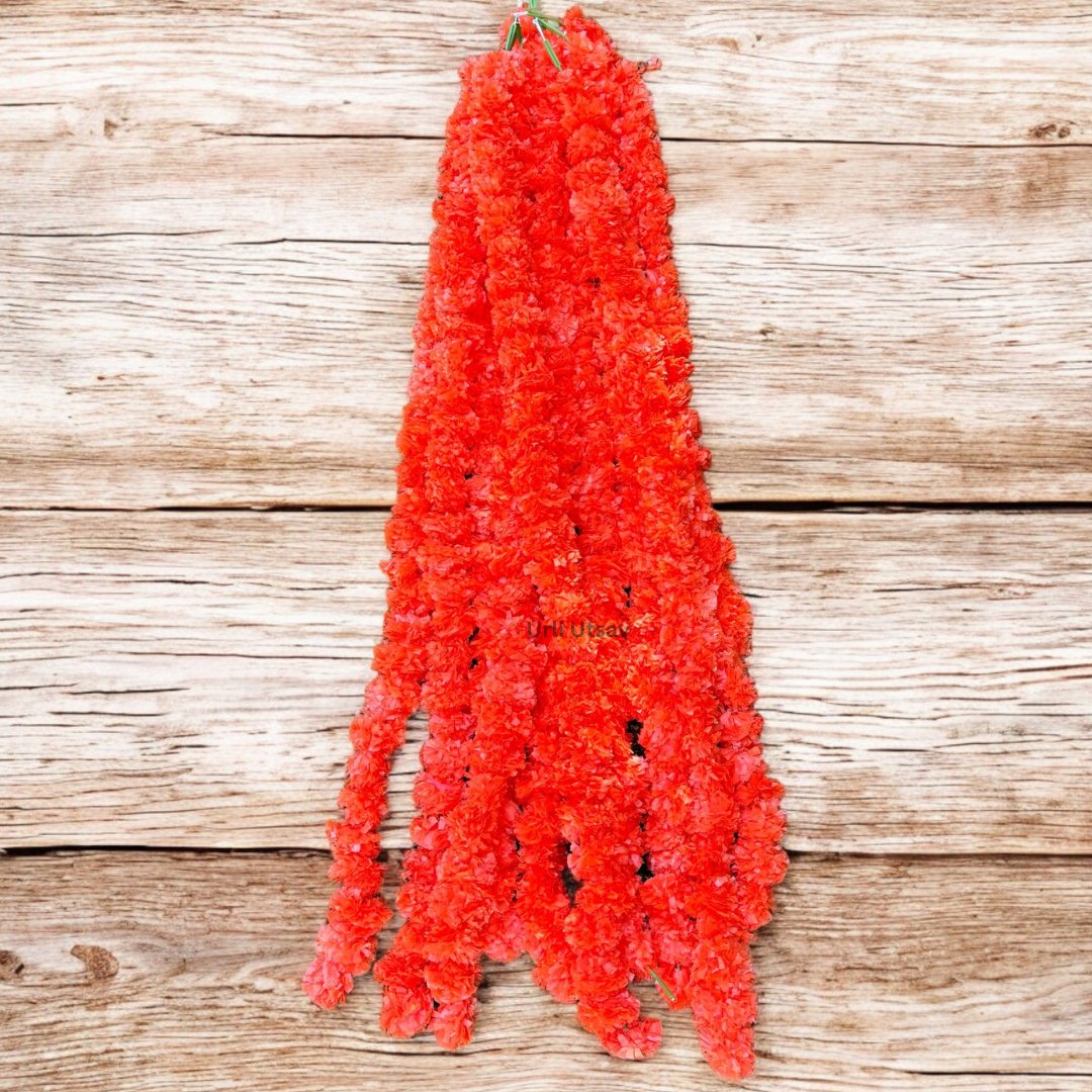 A set of ten orange artificial marigold garlands from Urli Utsav Decor, priced approx $2 per string