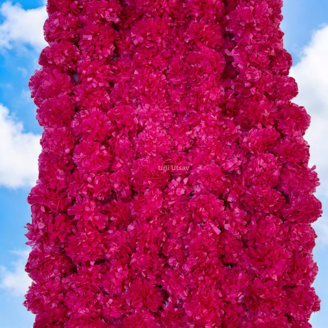 A set of ten pink artificial marigold garlands from Urli Utsav Decor, priced approx $2 per string