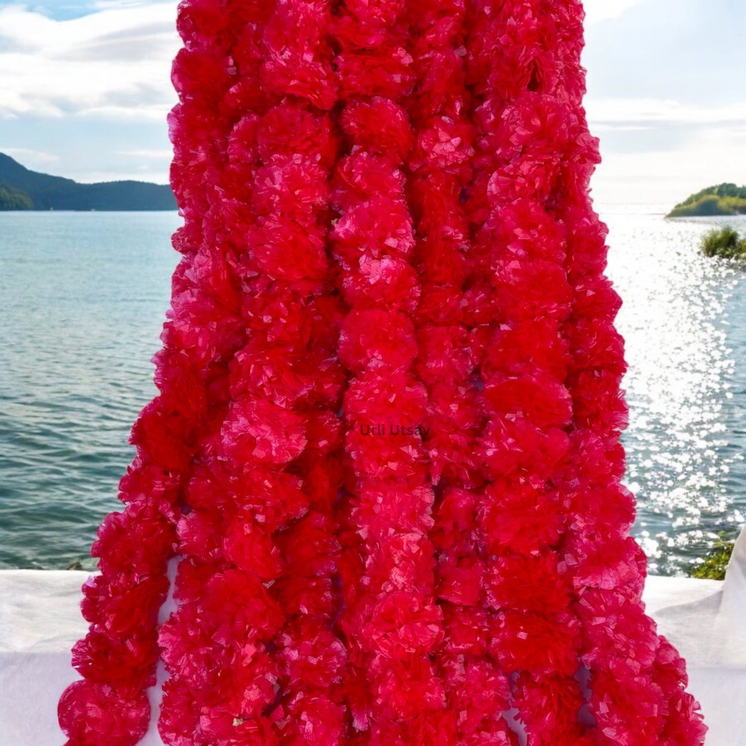 A set of ten red artificial marigold garlands from Urli Utsav Decor, priced approx $2 per string
