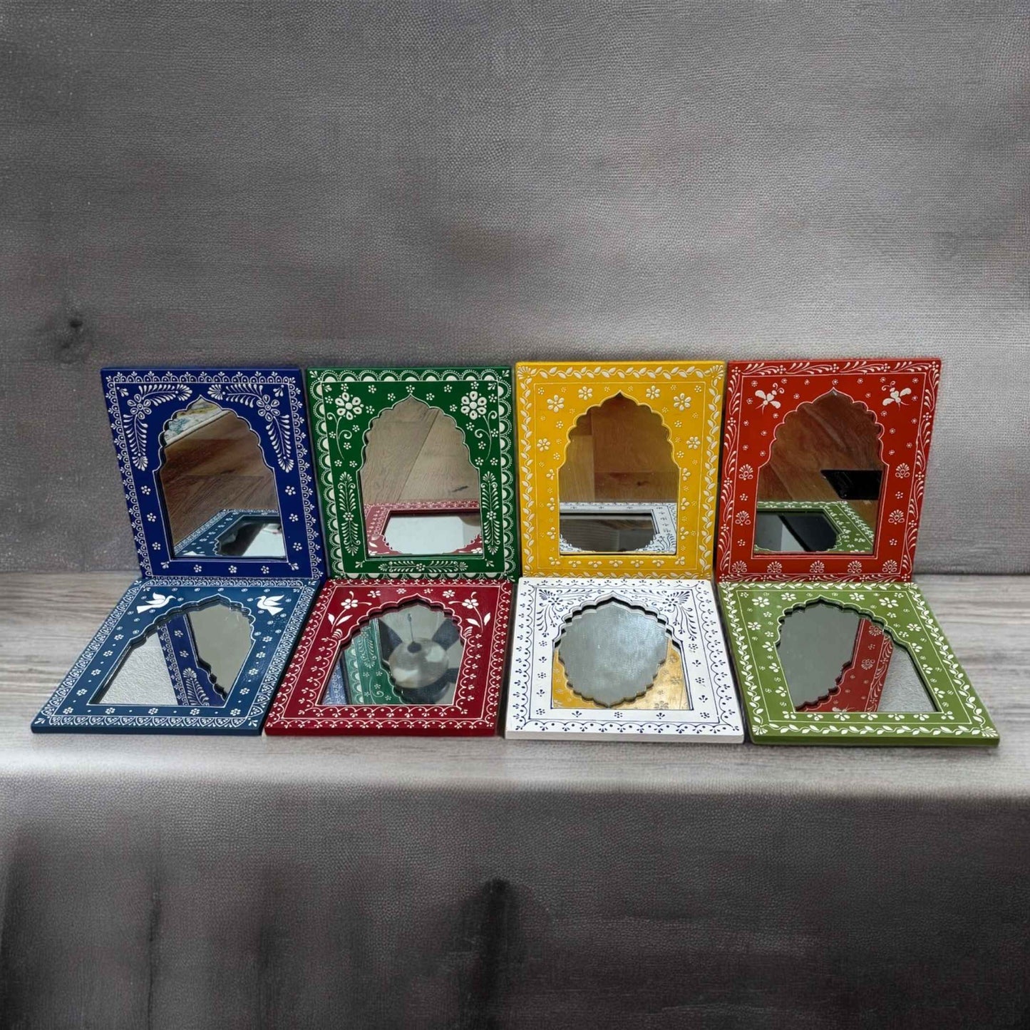 Close-up of the detailed hand-painted patterns on the Jharokha mirror by Urli Utsav, highlighting traditional Rajasthani craftsmanship