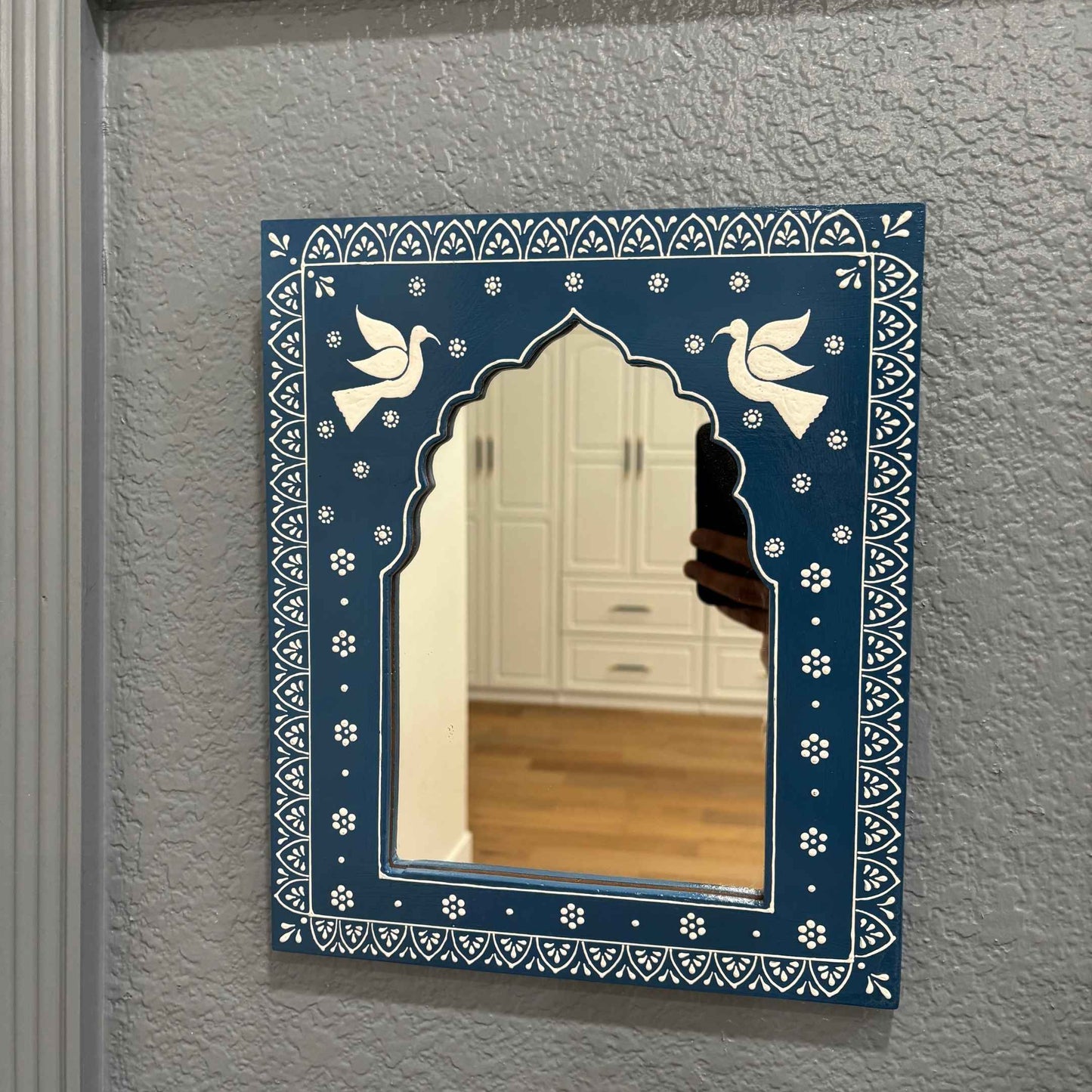 Hand-painted 12x10-inch Nile Blue Jharokha mirror by Urli Utsav, offering a dynamic view of its features