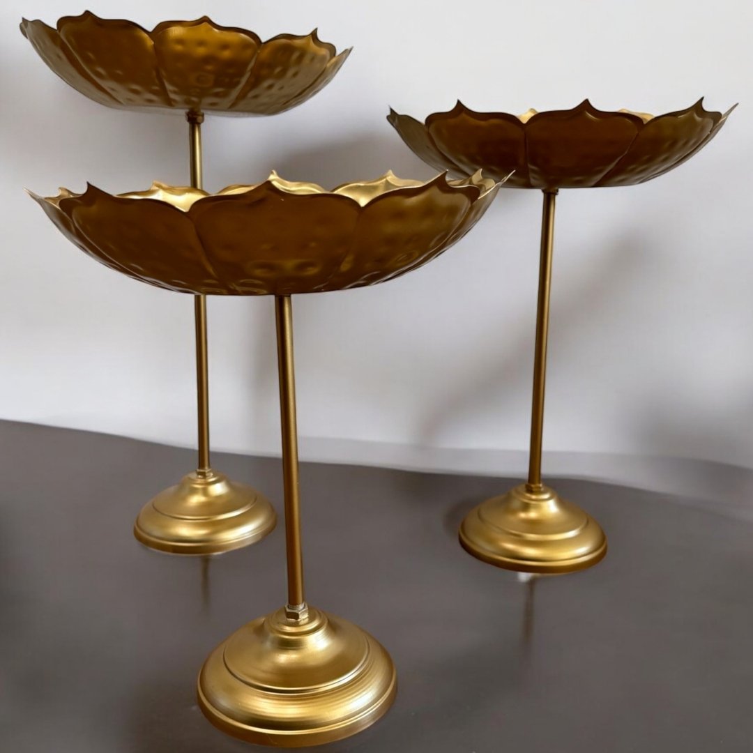 Side‑angle view of all three standing bowls grouped together on a tabletop, emphasizing their tiered arrangement and elegant proportions.