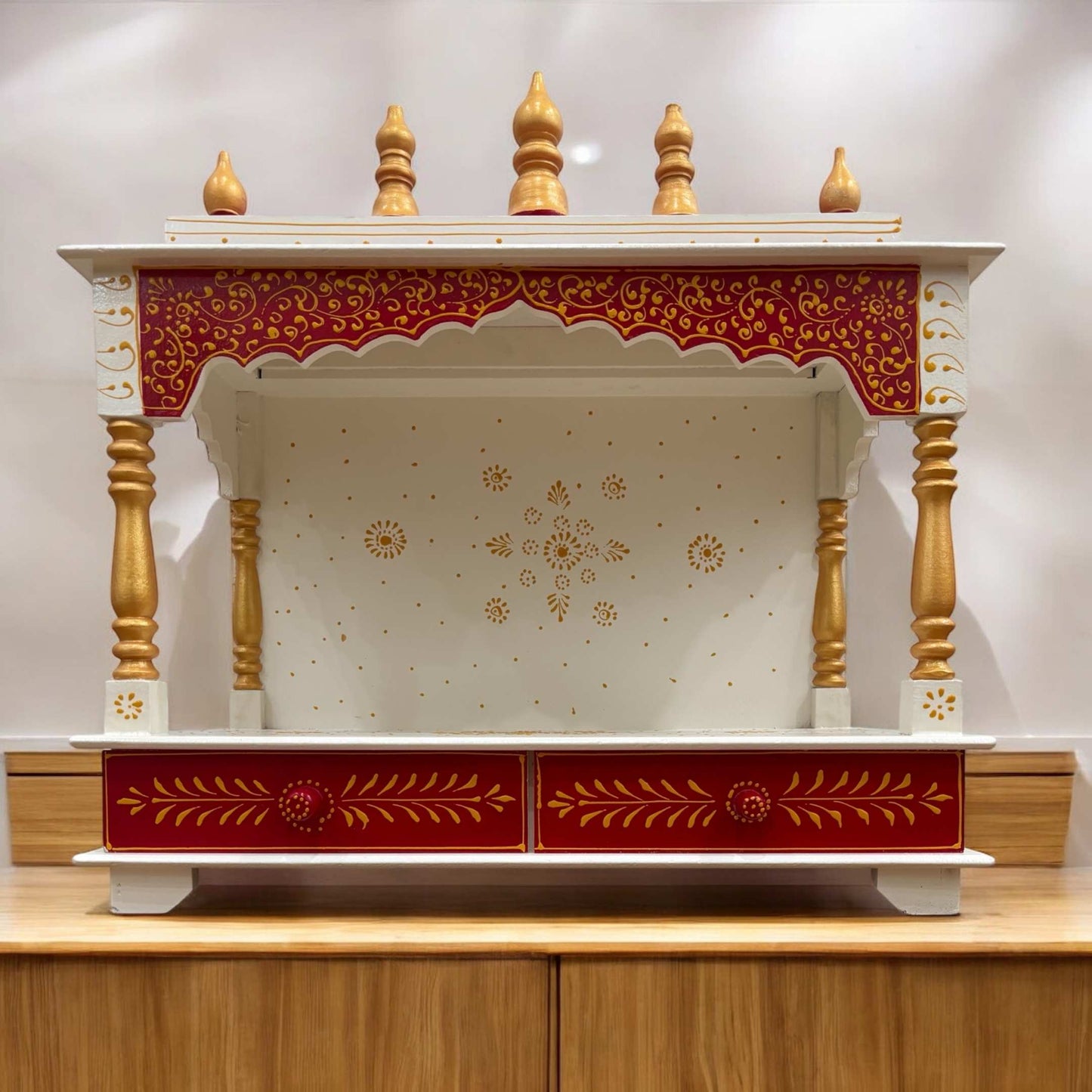 Elegant red wooden temple with intricate gold detailing and spacious shelves