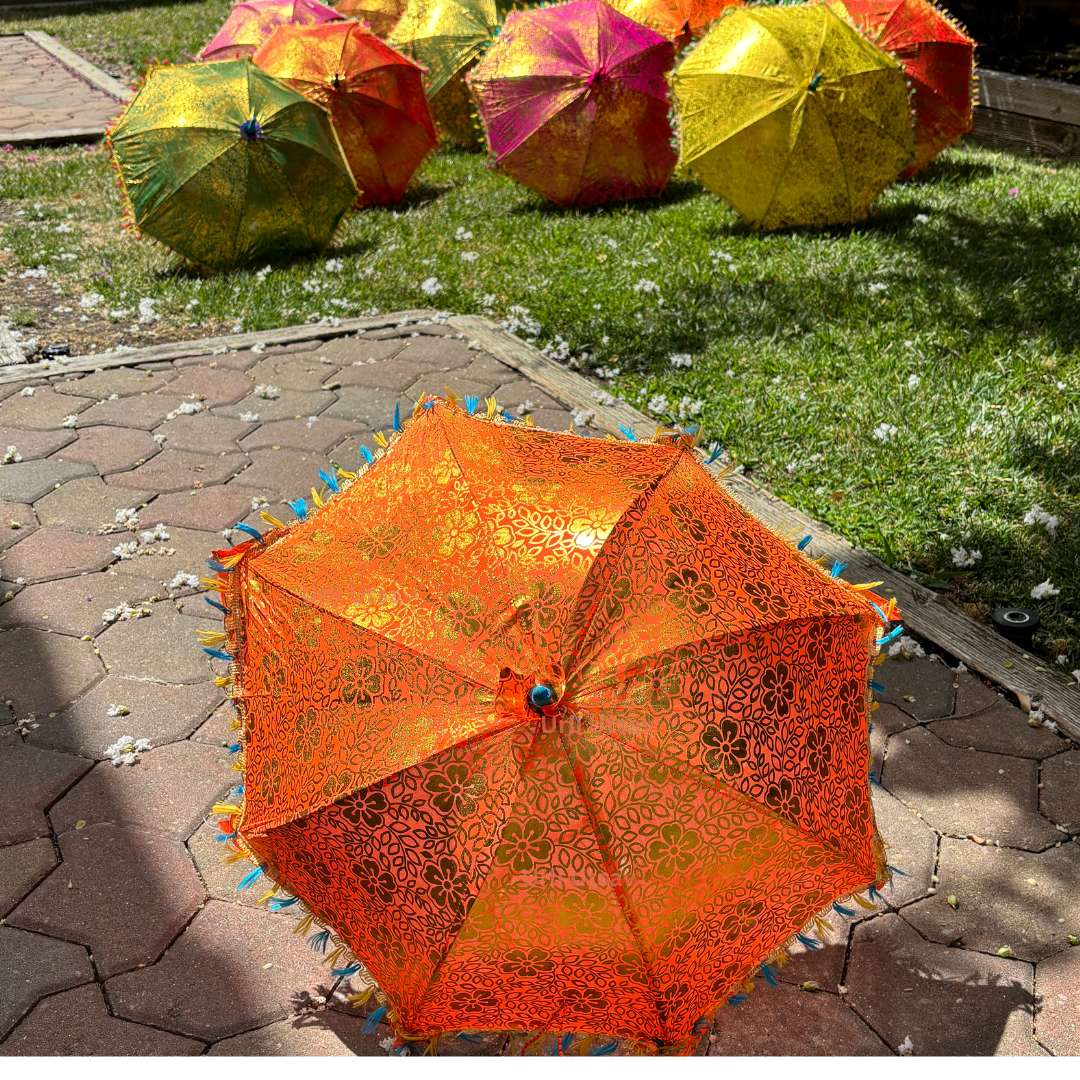 Bulk set of decorative silk umbrellas featuring multi-color patterns and golden accents