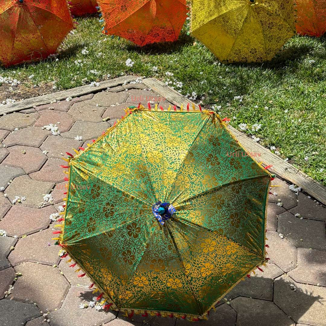 Collection of Rajasthani silk umbrellas with golden designs, perfect for use as backdrop umbrellas