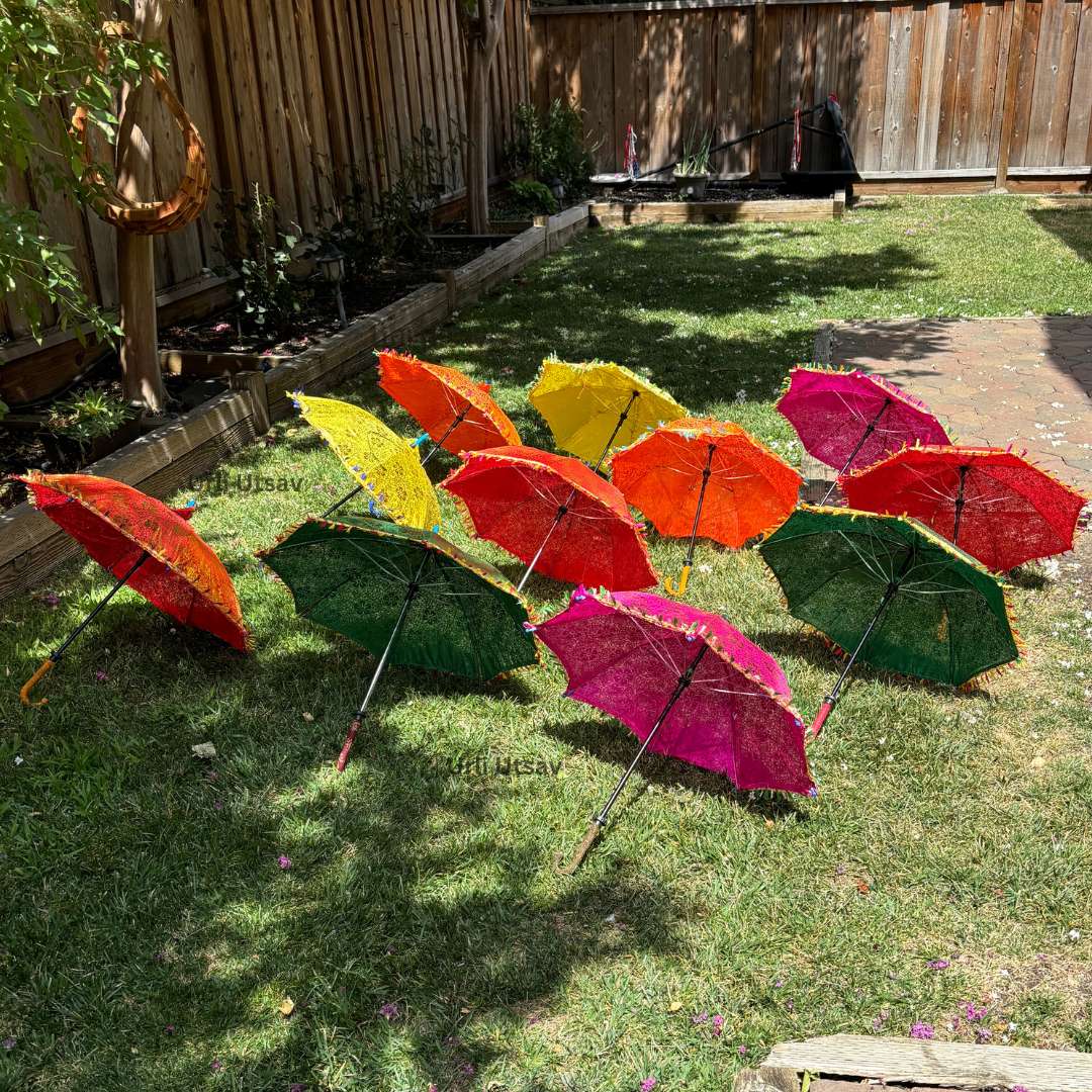 Golden silk umbrella with intricate Rajasthani patterns, ideal as a decorative backdrop umbrella Set of multi-color silk umbrellas featuring golden prints, perfect for bulk purchases for events