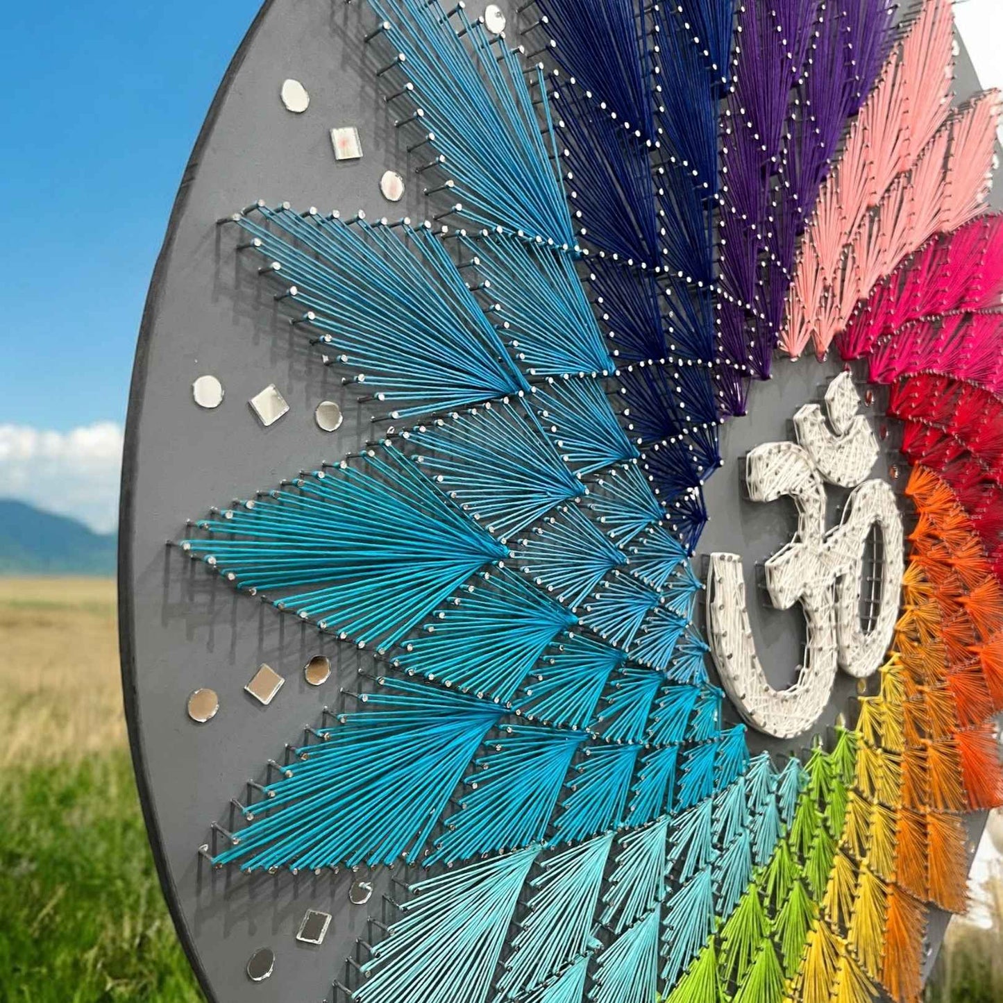 Side angle displaying the depth and texture of the 30-inch Om string art, emphasizing its three-dimensional appearance