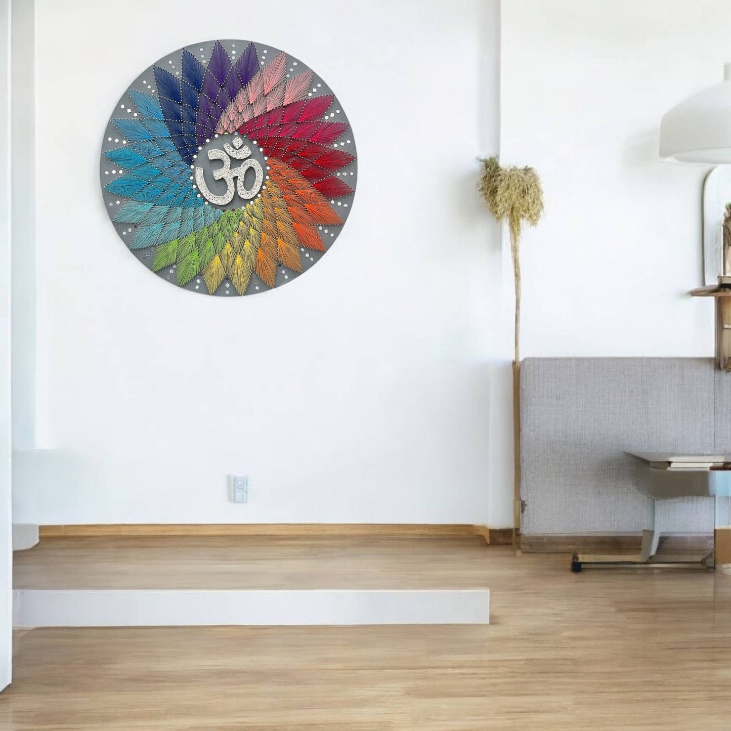 The Om string art mounted on a wall in a yoga room setting, illustrating its suitability as wall decor.