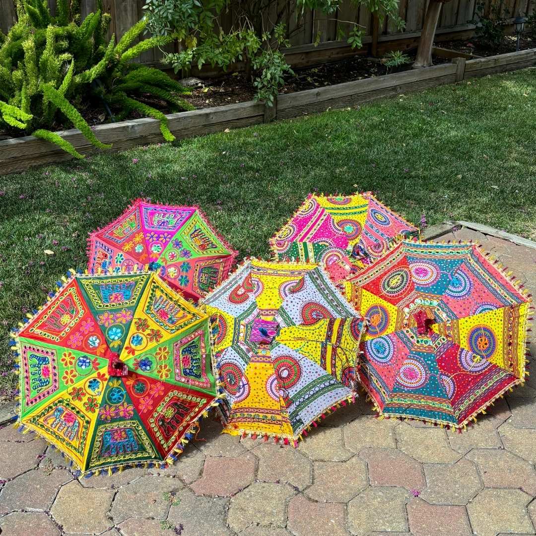 Elephant print umbrella with colorful Bandhani fabric, adding a touch of ethnic charm to any setting