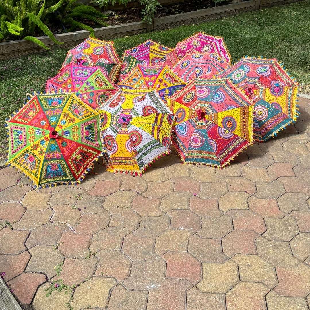 Elephant print umbrella with colorful Bandhani fabric, adding a touch of ethnic charm to any setting