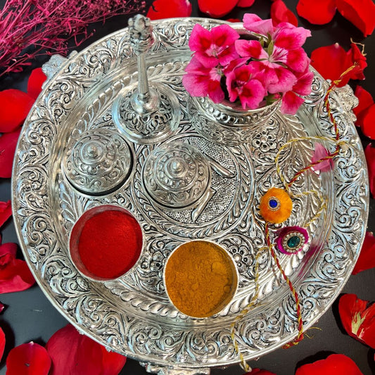 An 11-inch German Silver Swastika Pooja Thali Set featuring intricate hand-engraved designs, ideal for Laxmi Pujan rituals