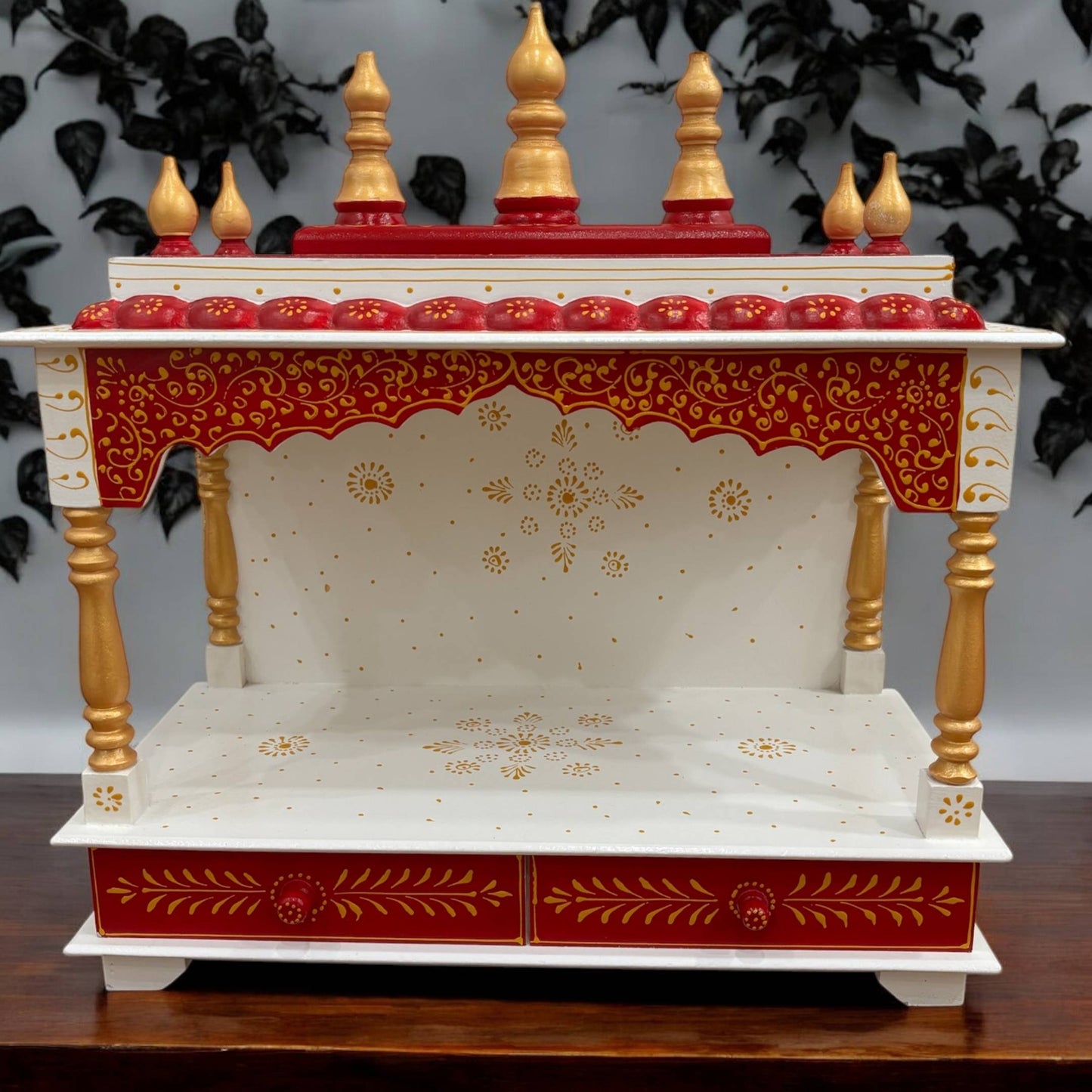 Front view of the 23x22x11 inch pooja mandir, featuring ornate carvings