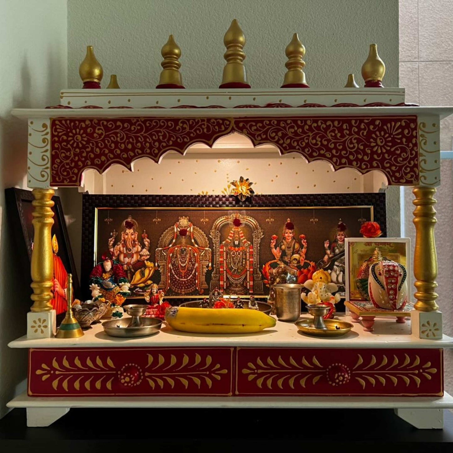 Spacious pooja mandir with multiple shelves for deities and accessories