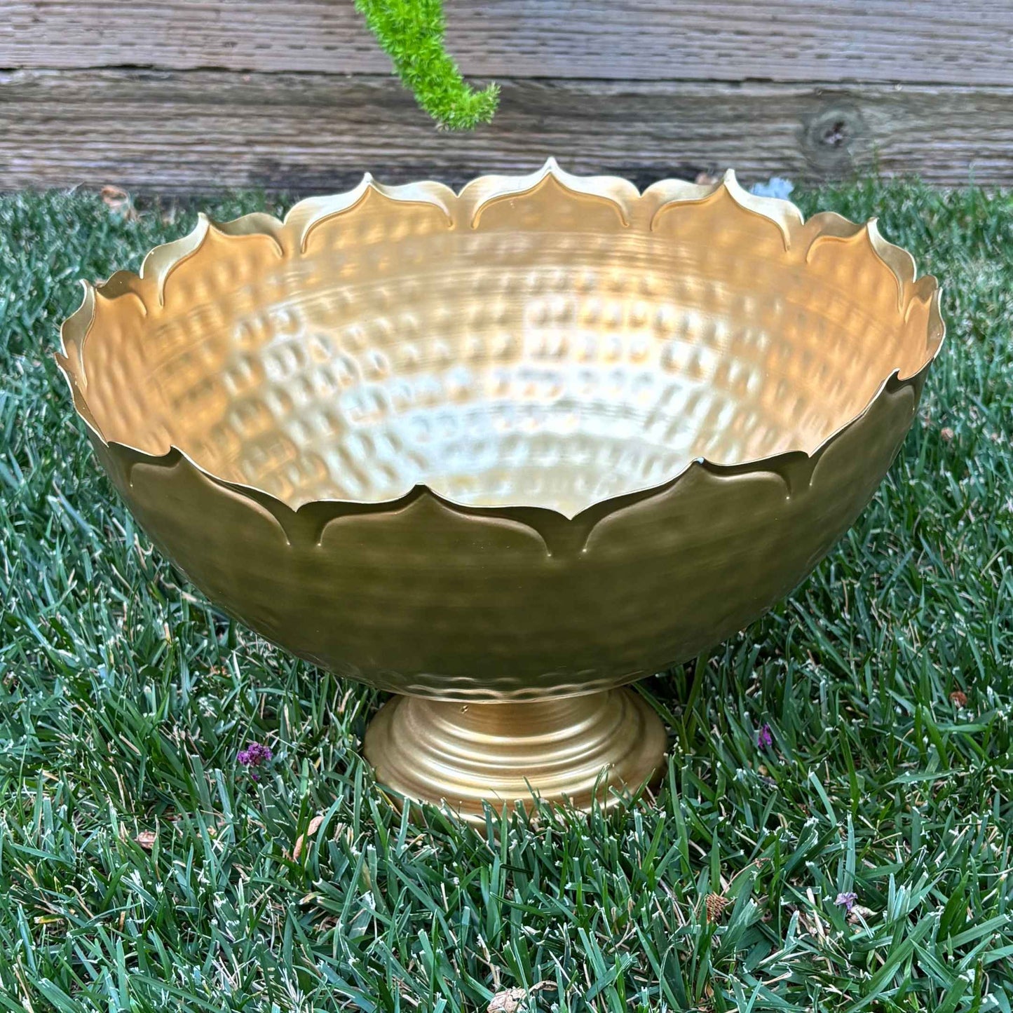 Handcrafted lotus decorative urli bowl highlighting fine engravings and a hammered finish for traditional Indian decor