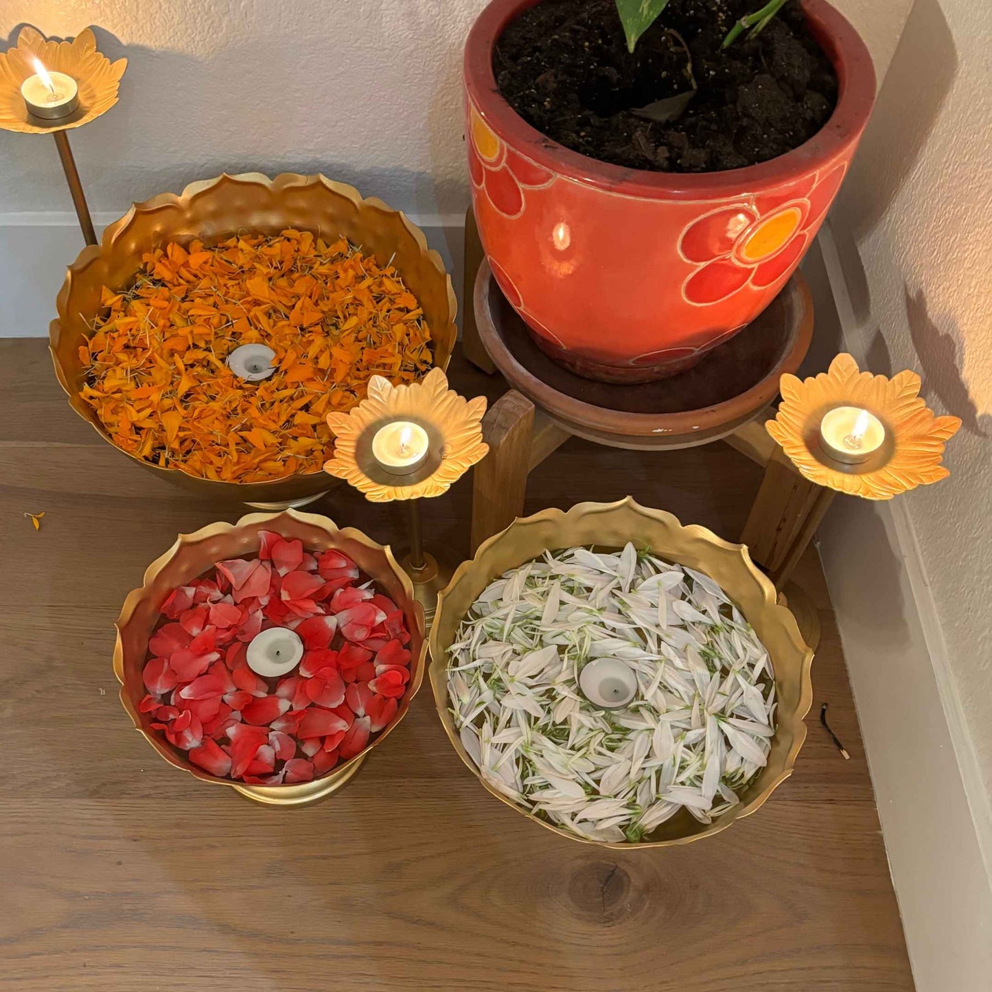 Set of 3 lotus-shaped decorative urli bowls placed together, showcasing their elegant design and versatility for pooja and Diwali decorations