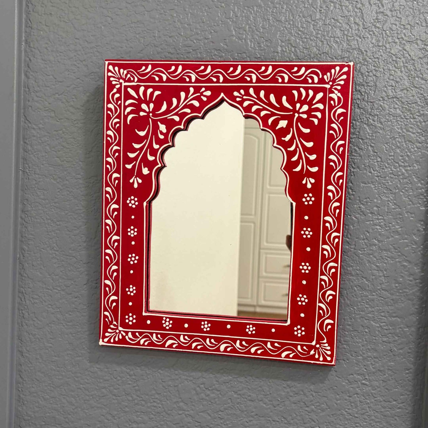 Handmade Red Jharokha Mirror Frame by Urli Utsav Decor, a stunning blend of Indian artistry and heritage.