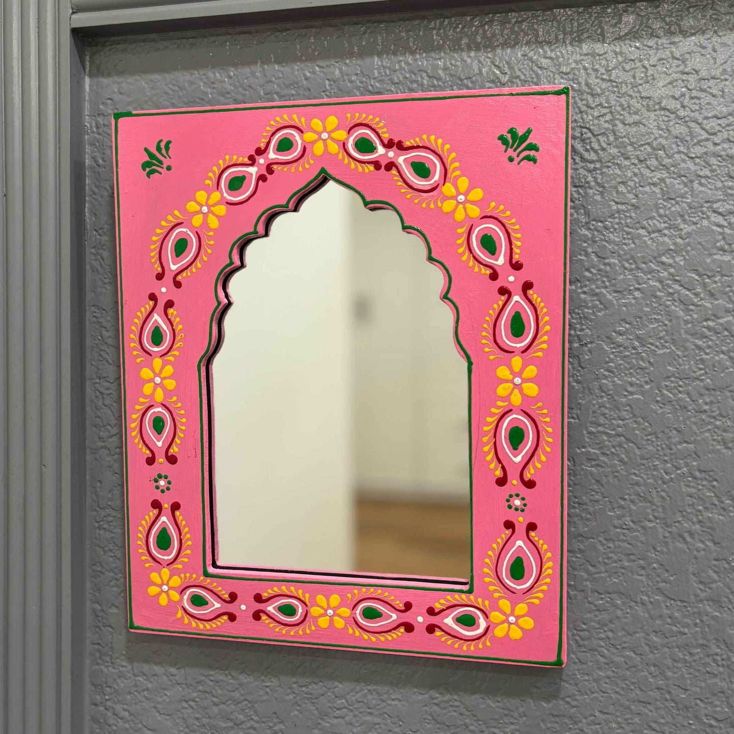 Handmade Pink Jharokha Mirror Frame By Urli Utsav Decor is a timeless piece that adds elegance and tradition to any space.