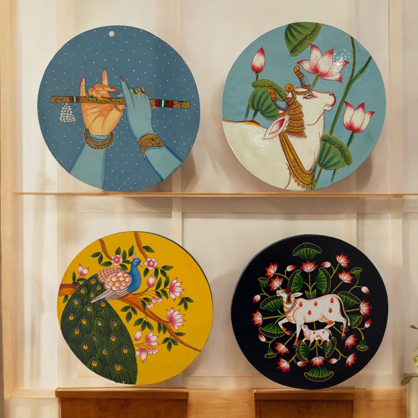 Handpainted wall plate displayed on a white wall, highlighting its vibrant colors and intricate bohemian patterns for home decor inspiration