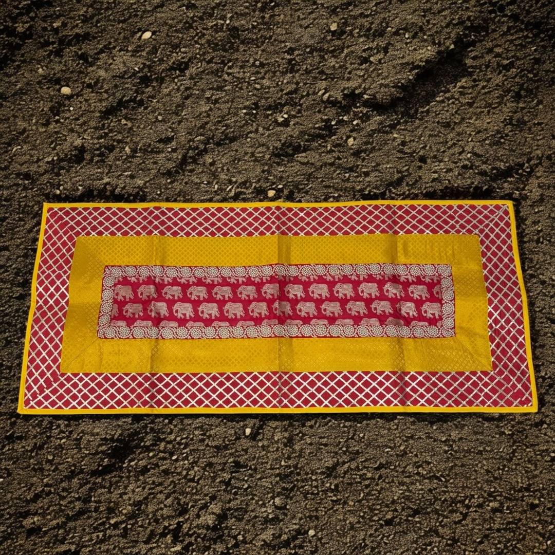 Decorative mat with elephant pattern on a dark surface