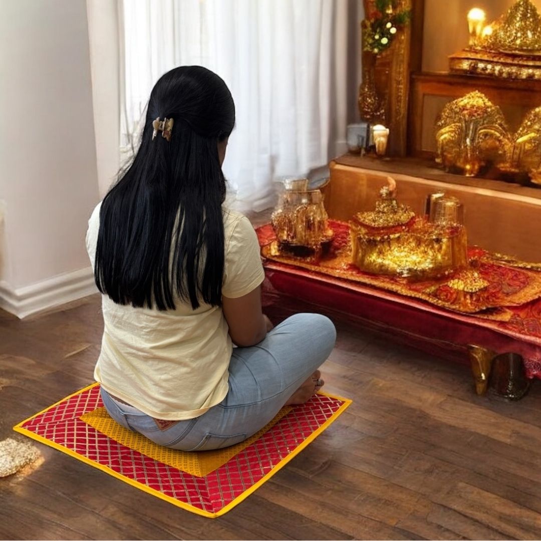 Elephant motif pooja aasan set styled under brass lamp—silk brocade meditation mat, cultural altar decoration.