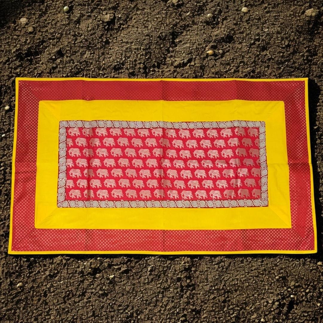 Decorative mat with elephant pattern on a textured surface