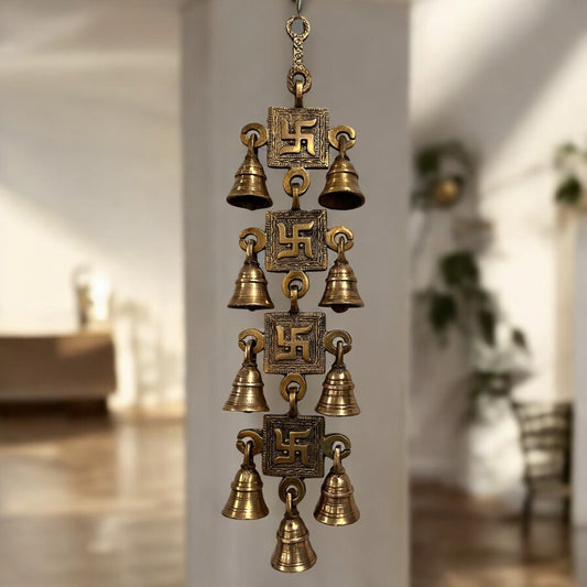 A handcrafted 15-inch brass Swastik wall hanging featuring intricate engravings and a polished gold finish, symbolizing prosperity and positive energy.