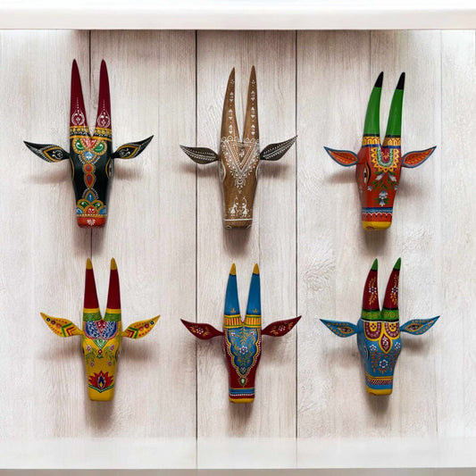 Hand-painted wooden Nandi cow head wall art by Urli Utsav, showcasing intricate ethnic designs in vibrant colors