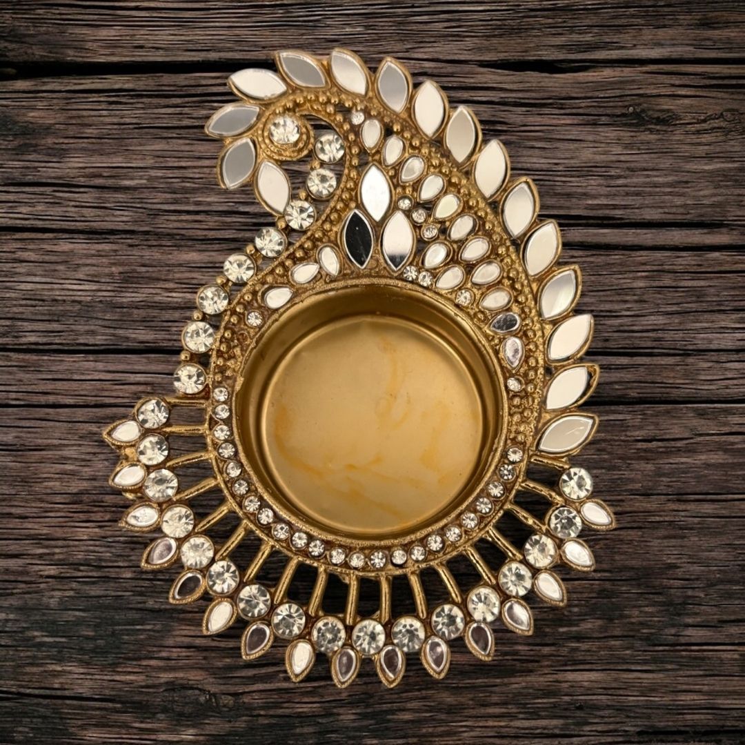 Handmade Indian mirror work candle holders glowing with t-lights