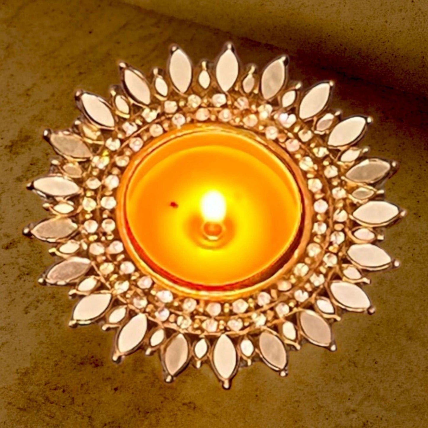 Gold Sunflower mirror t-light holder with crystal accents on wood background